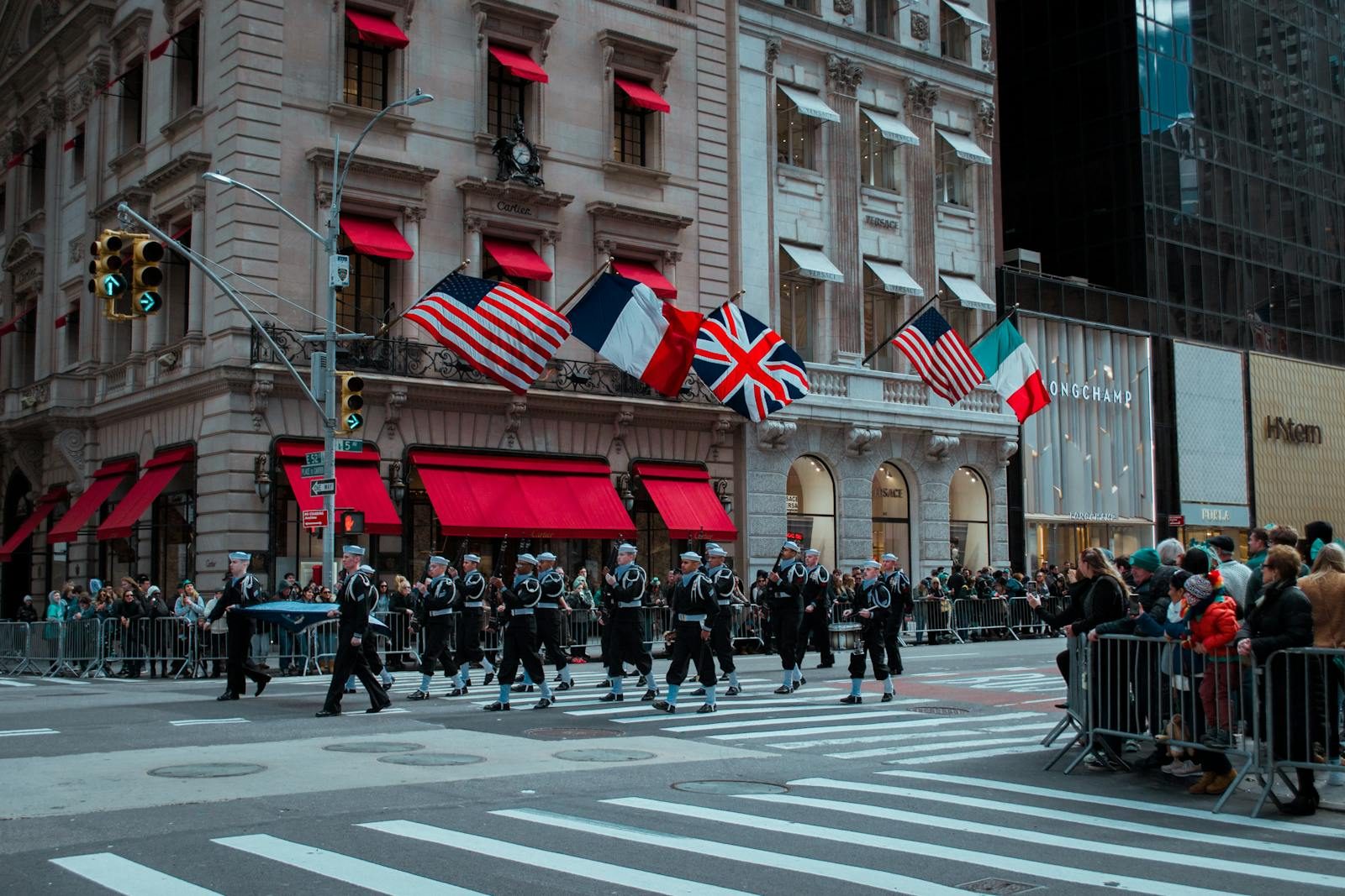 A colorful parade with marching band and flags in New York City, USA.